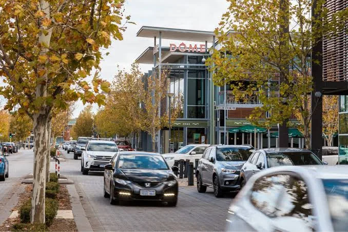 Ellenbrook town centre street with cafes and traffic, Ellenbrook WA