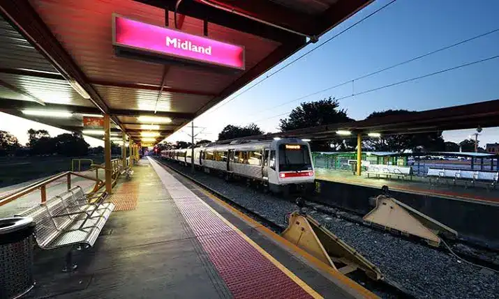 Midland train station platform with Transperth train at dusk, Midland WA